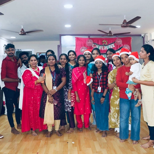 A joyful group gathering of students and staff celebrating togetherness at Christmas 2025.